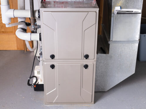 A double stage gas furnace in the basement of a Newton, MA home